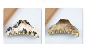Detail of 8cm triangular marble pattern hair claw clips with tortoiseshell resin finish