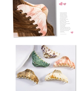 Detail of 8cm large marble pattern hair claws with wide teeth for thick hair styling
