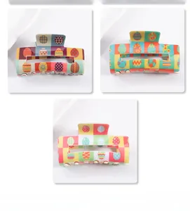 Detailed view of square PVC hair claws with Easter egg patterns in various colors