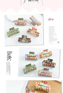 Macro detail of Easter egg pattern square PVC hair claw clips with colorful geometric prints