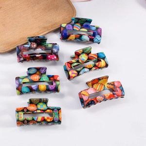 Set of six colorful Easter egg pattern square claw clips in bright vibrant resin material