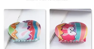 Macro detail of Easter hair claw clips with colorful striped patterns and cartoon rabbit
