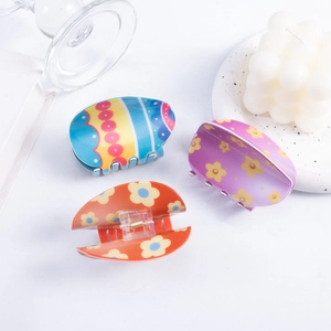 Three-piece Easter hair claw clips set with colorful floral and geometric egg patterns