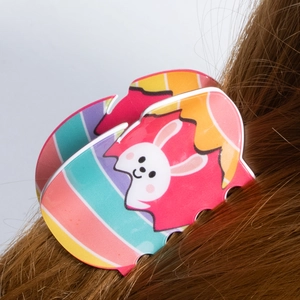 Colorful Easter bunny and egg pattern PVC hair claw clip for women holding brown long hair