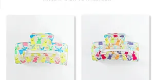 Detail of transparent hair claws with colorful rabbit prints in two vivid styles