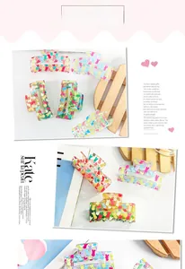 Detailed view of colorful cartoon rabbit prints on transparent square hair claw clips