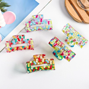Set of five transparent PVC hair claws with colorful bunny prints in various vibrant colors