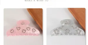 Vue détaillée des pinces à cheveux en acrylique à motif marbré avec décors en strass