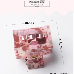 Detailed view of pink marble pattern hair claw clip with dimensions 4.8cm and 15g weight