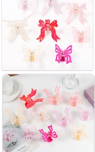 Detail of colorful bow and butterfly hair claws in acetate and vibrant acrylic materials