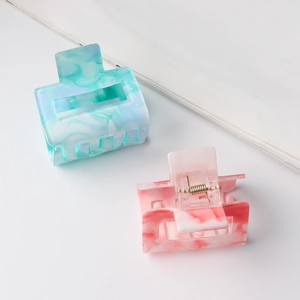 Square hollow hair claw clips with elegant marble pattern in green and pink colors