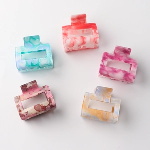Five assorted marble patterned square hollow hair claws made of high-quality PVC material