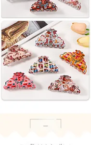 Detailed view of hollow design hair claws featuring colorful western cowboy patterns