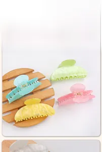 Detailed close-up of macaron color hair claws in blue, yellow, green, and pink colors