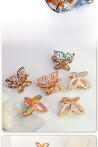 Butterfly hair claw clips with various patterns on gold metal base and acetate finish