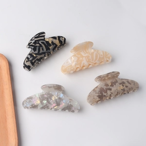 Set of four vintage textured acetate hair claws in various elegant marble patterns