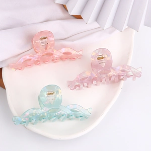Set di tre pinze per capelli iridescenti in colori pastello con design ondulato