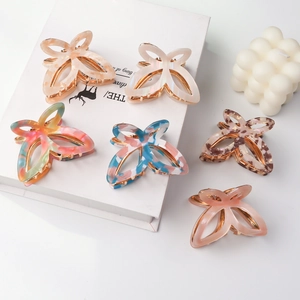 Set of six colorful butterfly hair claws in acetate and metal for women's hair styling