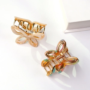 Set of two butterfly hair claws with marble textures in cream and macaron colors