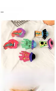 Detail of creative PVC 9cm hair claw clip featuring an alien spaceship and Get In Loser text