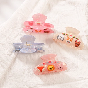 Set of four cute cartoon acetate shark hair claws in pink, blue, and cream colors