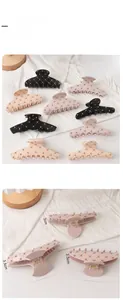 Detailed view of matte acrylic hair claw clips with gold bead accents and size measurements