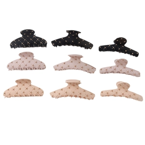 9-piece set of acrylic shark hair clips with diamond accents and quilted design
