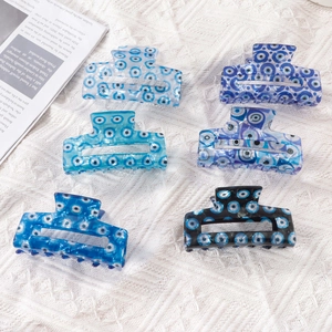 Set of six blue evil eye pattern hair claws made of PVC in 8cm rectangular design