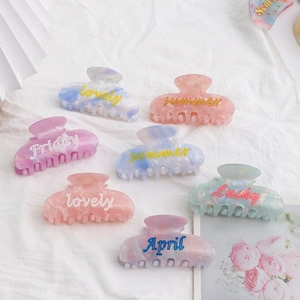 Pinces à cheveux colorées en acétate aux tons macaron avec texture marbrée élégante