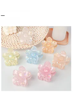Detailed view of 8cm colorful frangipani flower hair claw clips in pearl finish