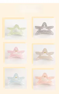 Star-shaped hair claws in multiple colors featuring marble patterns and acrylic texture
