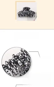 Detail view of large zebra stripe and black and white checkerboard floral hair claw clips