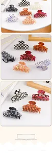 Assorted PVC hair claws with grid and marble patterns shown in lifestyle setting