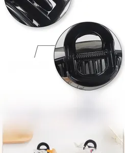 Detail showing the strong metal spring mechanism of a black matte hair claw clip