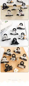 Detailed close-up of cute animal-shaped acetate hair claws including cat and dog designs