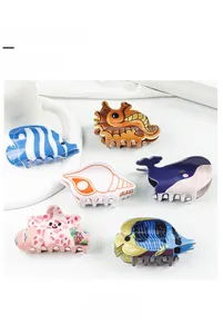 Detail view of 8cm marine theme hair claw clips with colorful cartoon sea creature patterns