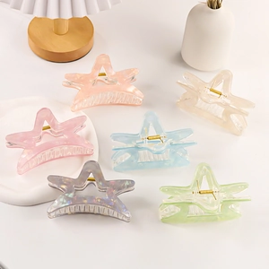 Star shaped iridescent hair claw clips in six colors with aesthetic hollow design