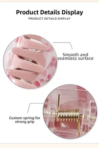 Detail view of pink floral hair claw clip with strong gold metal spring mechanism