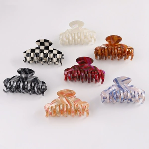 Set of 7 checkered and marble patterned hair claw clips with high-low teeth design
