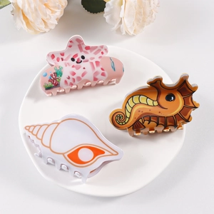 Cartoon ocean theme hair clips with pink starfish, seahorse and seashell designs