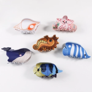 Set of 6 cute ocean animal PVC hair claws featuring whale, seahorse and seashell designs
