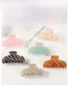Set of six large hair claw clips with various marbled textures and elegant colors