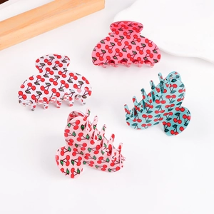Set of four cherry pattern hair claws in cream, pink, rose red, and turquoise finishes