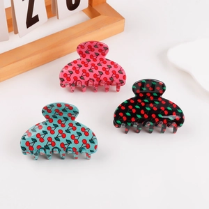 Three-piece hair claw clip set with cherry patterns in pink, light blue, and black colors