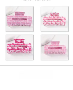 Close-up of rectangle claw clips with Bride lettering in pink and white resins