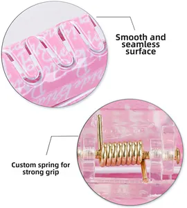 Detail view of pink hair claw clip showing smooth surface and durable metal spring