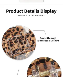 Detail of leopard print hair claw clip showing smooth finish and strong gold metal spring