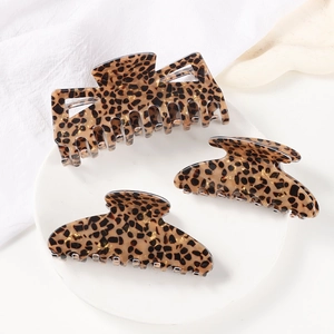 Vintage leopard print hair claw clips set for women in various shapes on white background