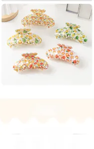Detailed set of 5 fruit print hair claw clips with orange and lemon patterns