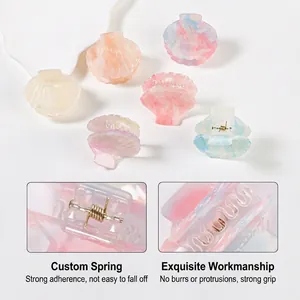 Pastel shell hair clips in pearlescent resin with durable gold metal springs